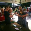 KRCL volunteer in action at the Downtown Farmer's Market